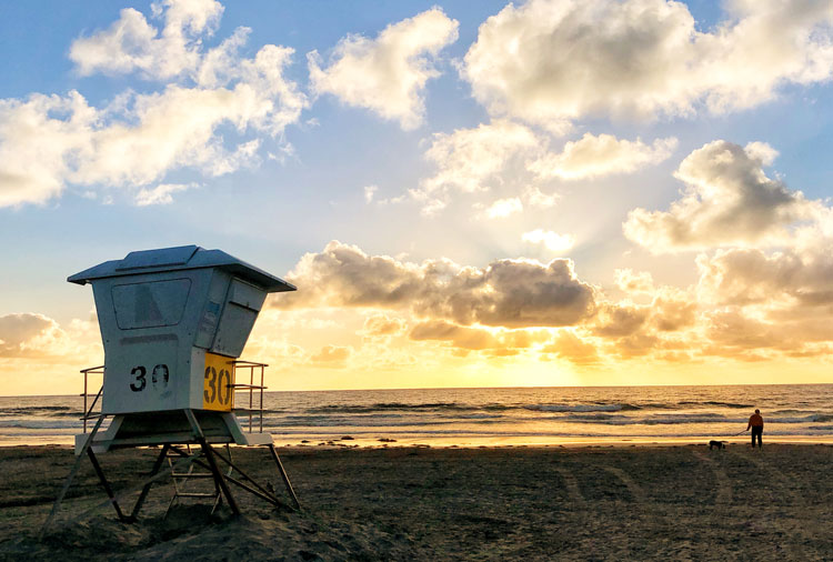The soft yellow sunset of La Jolla Shores at sunset.