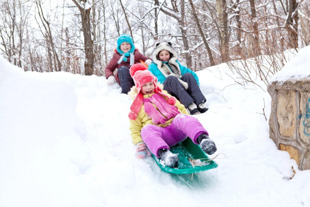 kids having fun sledding