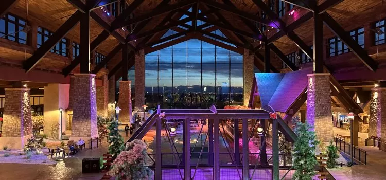 Gaylord Rockies Summer Fun for Families gaylord rockies atrium at night with views of the city and mountains