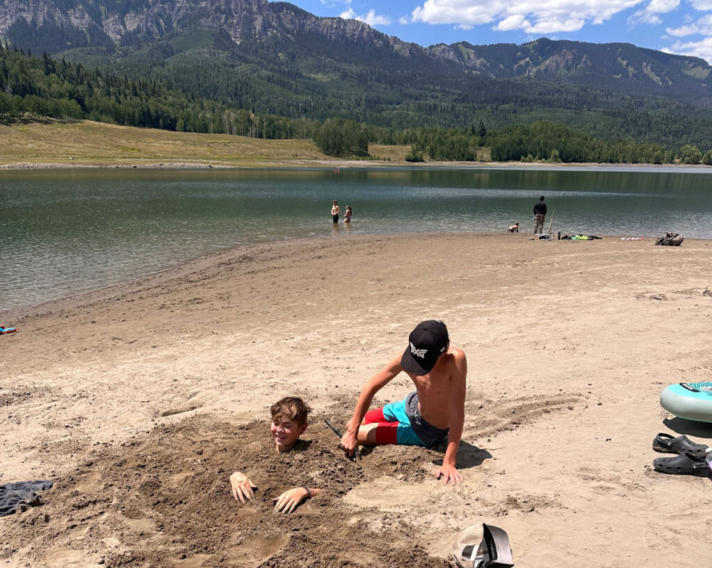 Kids playing on the beach at Silver Jack Reservoir.